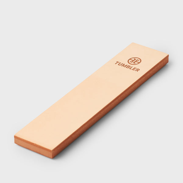 Peach colored rectangular Tumbler box with copper edges and embossed TUMBLER logo on a pale background.